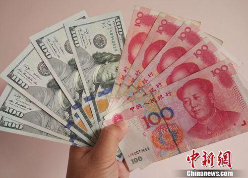 資料圖:人民幣和美元。<a target='_blank' _fcksavedurl='http://www.chinanews.com/' ></table>中新網</a>記者 李金磊 攝
